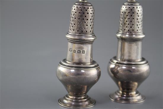 A pair of George V silver baluster pepperettes by S.W. Smith & Co, Birmingham, 1919, height 10.1cm, weight 3.5oz.